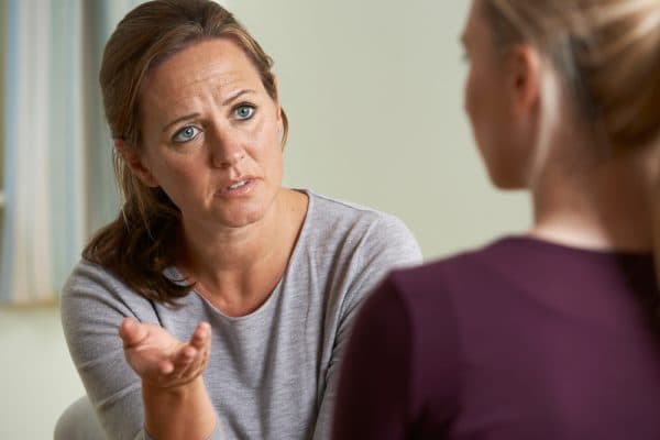 therapist talking to a patient