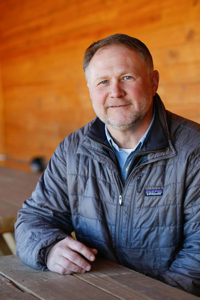 Troy Young, man in gray jacket sitting at table