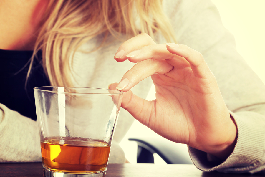 Young woman depressed with functioning alcoholism