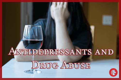 depressed woman with head in hands next to glass of wine