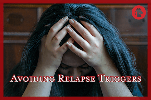 woman sitting down distraught because of relapsing on drugs