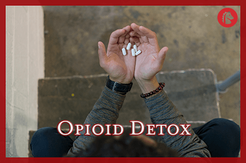 man holding pills in hand to help with opioid detox